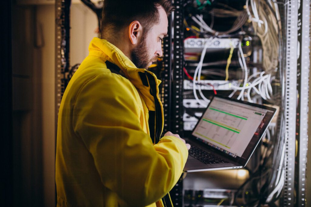 Young man working on a computer doings telecomunication services, Ai Advantage